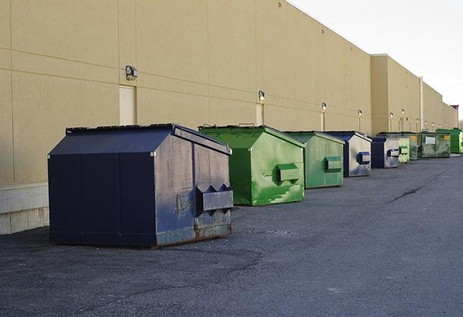 metal waste containers sit at a busy construction site in Emeryville, CA